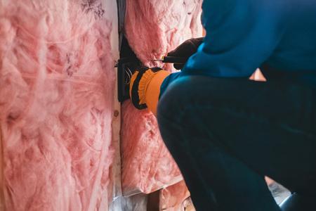 a man installing an insulation